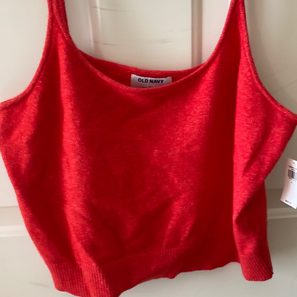 New with tags! Cropped sweater tank.  Wear alone or with button up underneath!